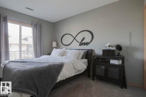 Carpeted bedroom featuring baseboards - 86 604 62 Street, Edmonton, AB - Indoor Photo Showing Bedroom