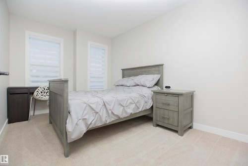 Bedroom with light colored carpet and baseboards - 15 Springbrook Wynd, Spruce Grove, AB - Indoor Photo Showing Bedroom