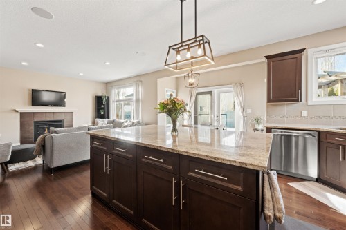 1477 Wates Link Link, Edmonton, AB - Indoor Photo Showing Kitchen With Fireplace