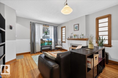 11234 68 Street, Edmonton, AB - Indoor Photo Showing Living Room With Fireplace