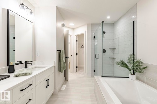 Full bath with double vanity, a garden tub, a spacious closet, a shower stall, and recessed lighting - 6275 180 Avenue, Edmonton, AB - Indoor Photo Showing Bathroom