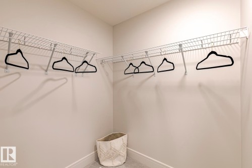 Walk in closet with carpet flooring - 6275 180 Avenue, Edmonton, AB - Indoor Photo Showing Other Room