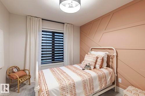 Carpeted bedroom with baseboards - 6275 180 Avenue, Edmonton, AB - Indoor Photo Showing Bedroom