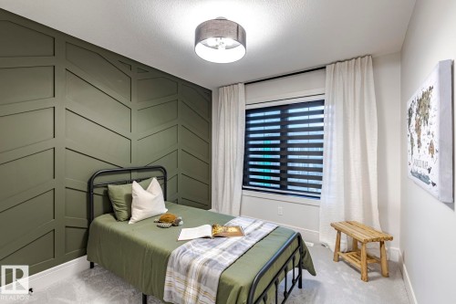 Bedroom featuring light colored carpet and a textured ceiling - 6275 180 Avenue, Edmonton, AB - Indoor Photo Showing Bedroom