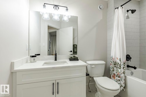 Full bath with shower / tub combo with curtain and vanity - 6275 180 Avenue, Edmonton, AB - Indoor Photo Showing Bathroom