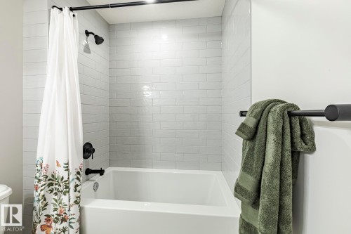 Bathroom with toilet and shower / tub combo - 6275 180 Avenue, Edmonton, AB - Indoor Photo Showing Bathroom