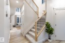 Stairs featuring wood finished floors and a high ceiling - 6275 180 Avenue, Edmonton, AB  - Indoor Photo Showing Other Room 