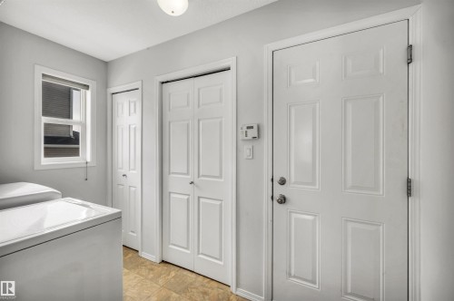 Laundry room with separate washer and dryer - 3401 47 Street, Beaumont, AB - Indoor
