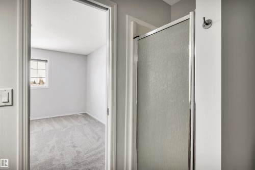 Bathroom with light carpet and a stall shower - 3401 47 Street, Beaumont, AB - Indoor