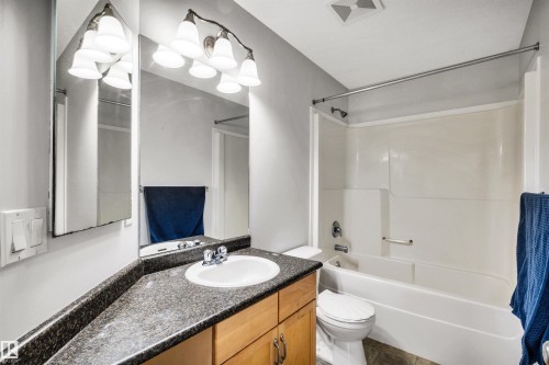 Full bath featuring vanity and shower / washtub combination - 3401 47 Street, Beaumont, AB - Indoor Photo Showing Bathroom