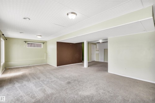 Basement with light carpet and baseboards - 3401 47 Street, Beaumont, AB - Indoor