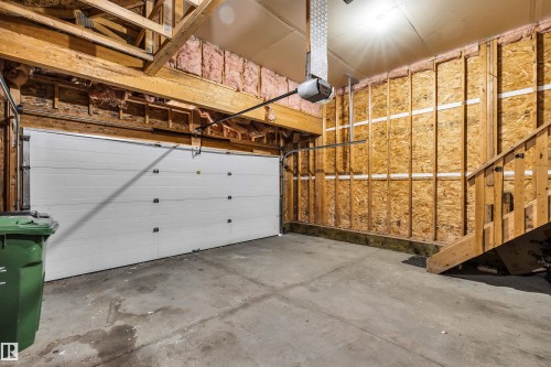 Garage with a garage door opener - 3401 47 Street, Beaumont, AB - Indoor Photo Showing Garage