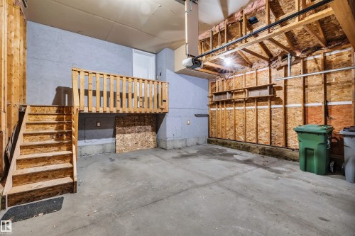 Garage featuring a garage door opener - 3401 47 Street, Beaumont, AB - Indoor Photo Showing Garage