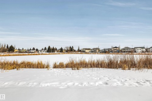View of yard featuring a residential view - 3401 47 Street, Beaumont, AB - Outdoor With View