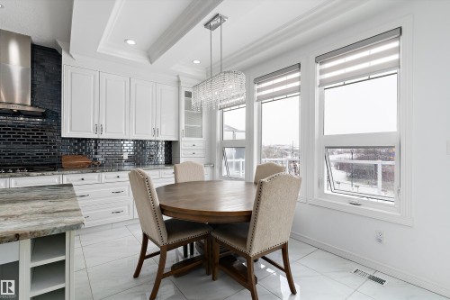Dining room with recessed lighting and crown molding - 1242 Starling Drive, Edmonton, AB - Indoor Photo Showing Dining Room