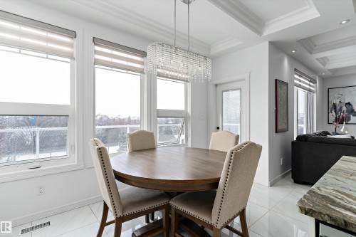 Dining space with crown molding and a chandelier - 1242 Starling Drive, Edmonton, AB - Indoor Photo Showing Dining Room
