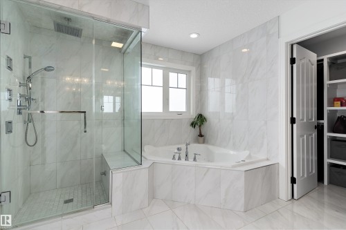 Bathroom featuring a marble finish shower and a garden tub - 1242 Starling Drive, Edmonton, AB - Indoor Photo Showing Bathroom