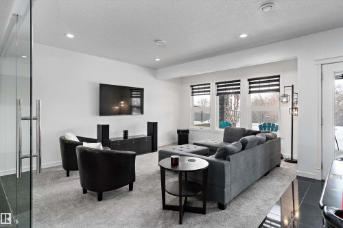 Living area with a textured ceiling and recessed lighting - 1242 Starling Drive, Edmonton, AB - Indoor Photo Showing Living Room