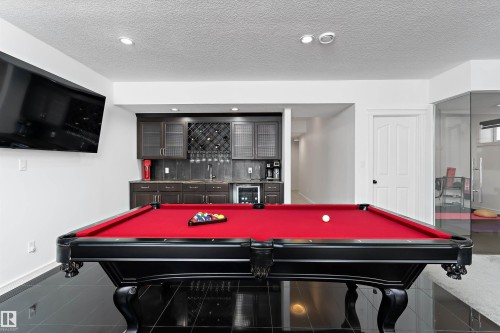 Rec room featuring billiards table, beverage cooler, bar, recessed lighting, and a textured ceiling - 1242 Starling Drive, Edmonton, AB - Indoor Photo Showing Other Room