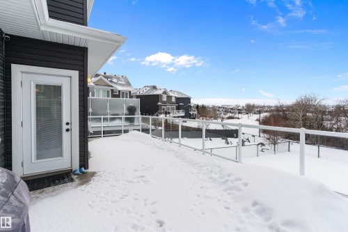 Yard layered in snow with a residential view - 1242 Starling Drive, Edmonton, AB - Outdoor