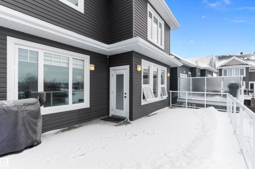 Snow covered property entrance with a deck - 1242 Starling Drive, Edmonton, AB - Outdoor