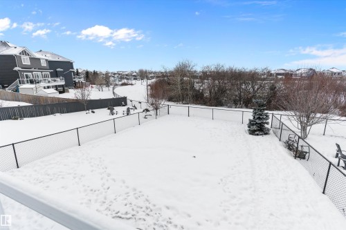 Snowy yard featuring a fenced backyard and a residential view - 1242 Starling Drive, Edmonton, AB - Outdoor