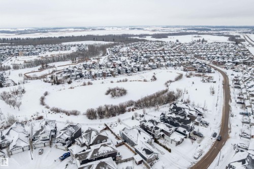 Snowy aerial view featuring a residential view - 1242 Starling Drive, Edmonton, AB - Outdoor With View