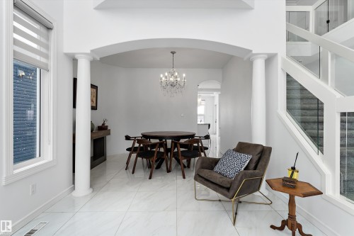 Dining space featuring decorative columns, hanging lights, and arched walkways - 1242 Starling Drive, Edmonton, AB - Indoor