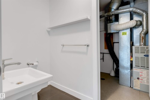 Bathroom with heating unit - 102 10711 83 Avenue, Edmonton, AB - Indoor Photo Showing Bathroom