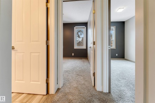 Corridor with light carpet - 102 10711 83 Avenue, Edmonton, AB - Indoor Photo Showing Other Room