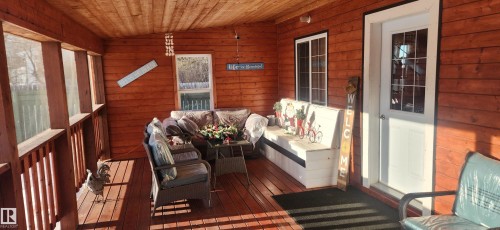 Sunroom / solarium featuring vaulted ceiling - 5216 - 53 Avenue, Clyde, AB - Outdoor With Deck Patio Veranda With Exterior