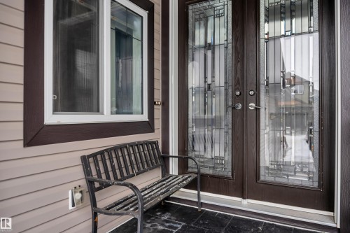 View of exterior entry featuring french doors - 2612 Adam Court Sw, Edmonton, AB - Outdoor With Deck Patio Veranda With Exterior