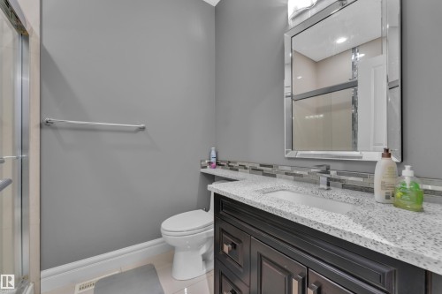 Full bathroom featuring vanity, a stall shower, and light tile patterned flooring - 2612 Adam Court Sw, Edmonton, AB - Indoor Photo Showing Bathroom