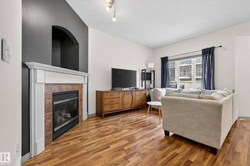 3955 Mcmullen Green, Edmonton, AB - Indoor Photo Showing Living Room With Fireplace