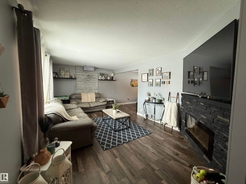 4825 55 Avenue, Drayton Valley, AB - Indoor Photo Showing Living Room With Fireplace
