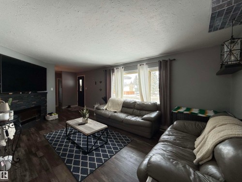 4825 55 Avenue, Drayton Valley, AB - Indoor Photo Showing Living Room With Fireplace