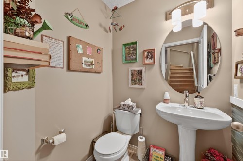 Half bath featuring toilet - 14 1140 Chappelle Boulevard, Edmonton, AB - Indoor Photo Showing Bathroom