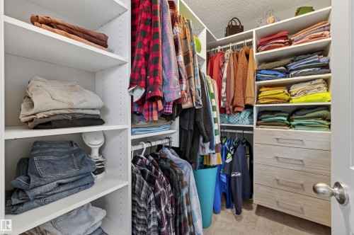 Walk in closet with light carpet - 14 1140 Chappelle Boulevard, Edmonton, AB - Indoor With Storage