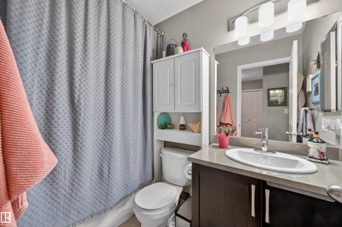 Bathroom featuring vanity and a textured ceiling - 14 1140 Chappelle Boulevard, Edmonton, AB - Indoor Photo Showing Bathroom