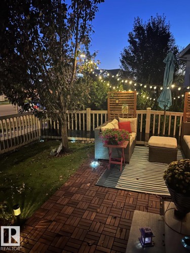 Wooden terrace featuring an outdoor lounge area and area for grilling - 14 1140 Chappelle Boulevard, Edmonton, AB - Outdoor With Deck Patio Veranda