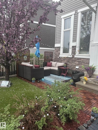 View of patio featuring a wooden deck and outdoor seating - 14 1140 Chappelle Boulevard, Edmonton, AB - Outdoor