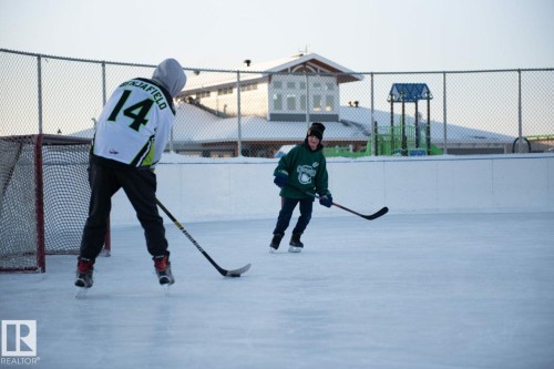 This property includes access to a well-maintained outdoor ice rink, perfect for winter recreation - 14 1140 Chappelle Boulevard, Edmonton, AB - Outdoor