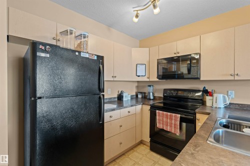 320 4309 33 Street, Stony Plain, AB - Indoor Photo Showing Kitchen With Double Sink