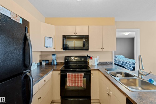 320 4309 33 Street, Stony Plain, AB - Indoor Photo Showing Kitchen With Double Sink