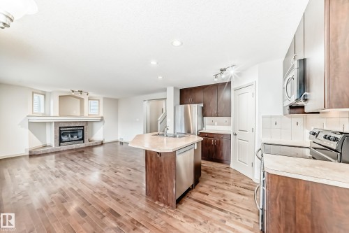 5930 165 Avenue, Edmonton, AB - Indoor Photo Showing Kitchen With Fireplace With Stainless Steel Kitchen