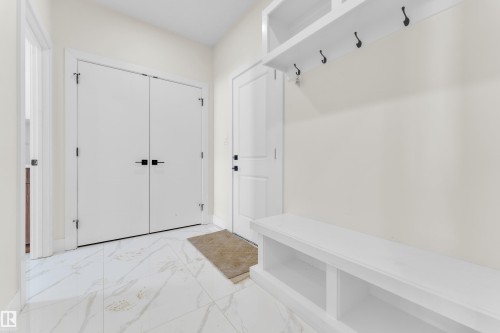 Mudroom with light marble finish floors and baseboards - 231 Crystal Creek Drive, Leduc, AB - Indoor Photo Showing Other Room