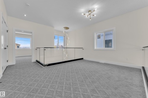 Spare room with light colored carpet and recessed lighting - 231 Crystal Creek Drive, Leduc, AB - Indoor Photo Showing Other Room