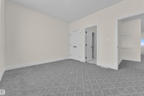 Unfurnished bedroom with light colored carpet - 231 Crystal Creek Drive, Leduc, AB - Indoor Photo Showing Other Room