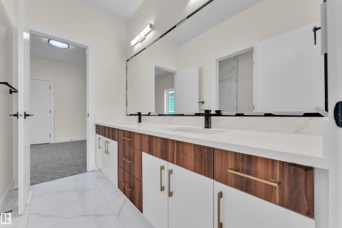 Bathroom with double vanity and light marble finish flooring - 231 Crystal Creek Drive, Leduc, AB - Indoor