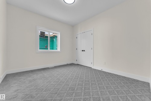 Unfurnished room with baseboards and light colored carpet - 231 Crystal Creek Drive, Leduc, AB - Indoor Photo Showing Other Room